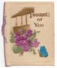 The front of a Christmas card with purple flowers on it. There is a brown building in the background and a blue butterfly in the foreground. There is a piece of purple string along the fold. The card says, "Thoughts of You".